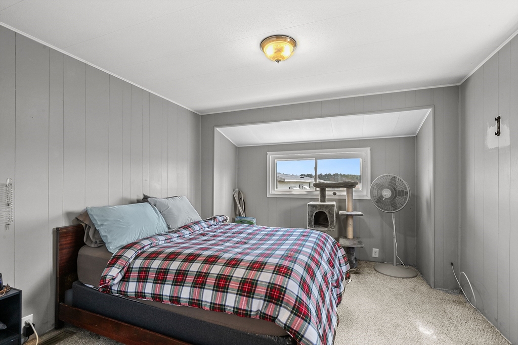 58 Bally Drive Raynham, MA 02767 - Photo 8 of 9 a bedroom with a bed and a window