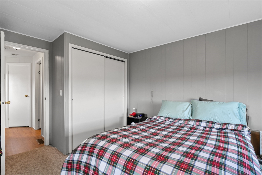 58 Bally Drive Raynham, MA 02767 - Photo 9 of 9 a bedroom with a bed and a dresser