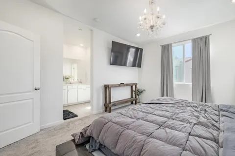 a view of a bedroom with bathroom