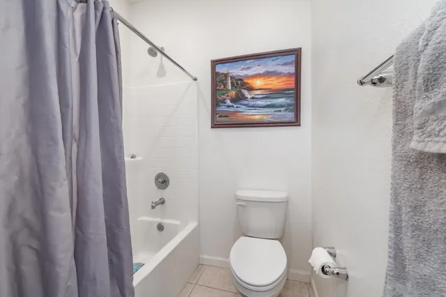 a bedroom with a bed and a shower