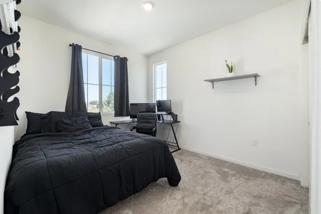 a utility room with cabinets washer and dryer
