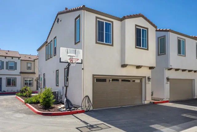 an aerial view of a city with lots of residential buildings