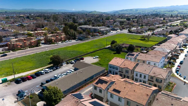 a view of a patio with a table and chairs