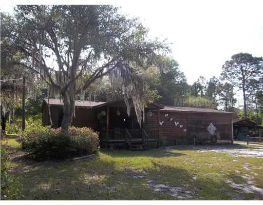 2660 South Bear Run Road Frostproof, FL 33843 - Photo 1 of 1 a view of a house with a backyard
