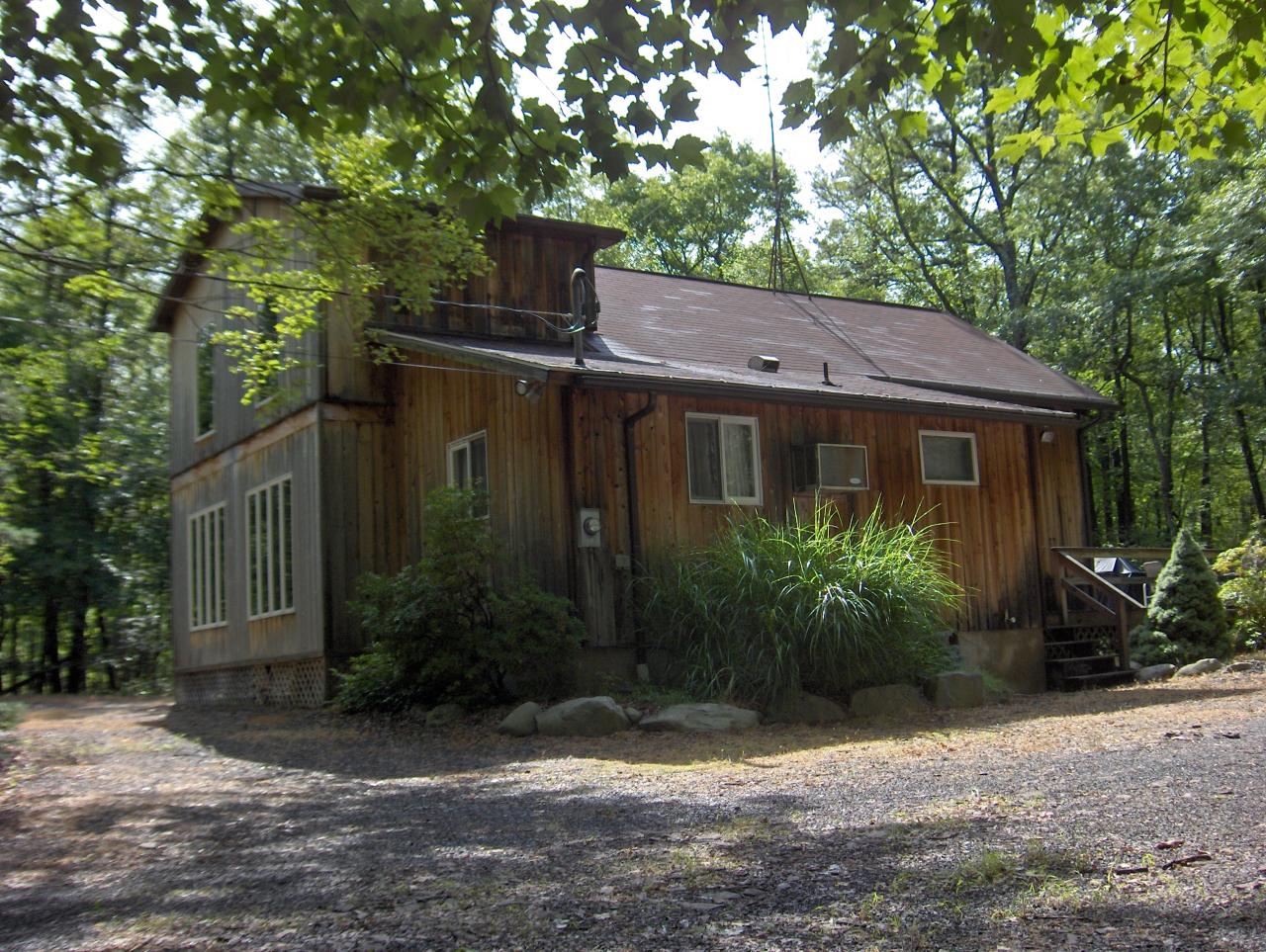 402 Big Oak Road Canadensis, PA 18325 - Photo 1 of 18 a view of a house with a tree in front of it
