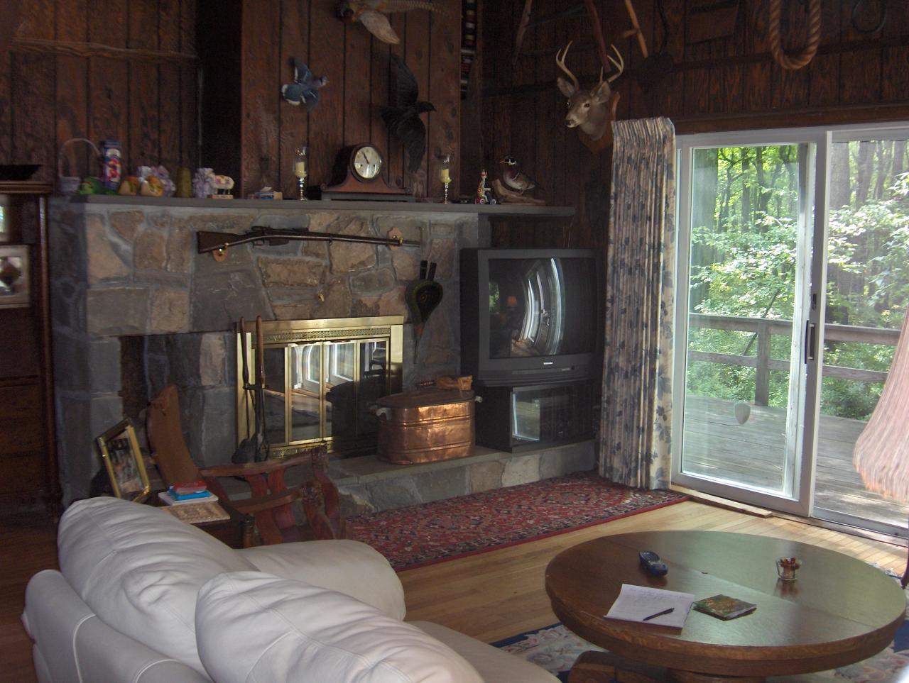 402 Big Oak Road Canadensis, PA 18325 - Photo 8 of 18 a living room with furniture and a fireplace