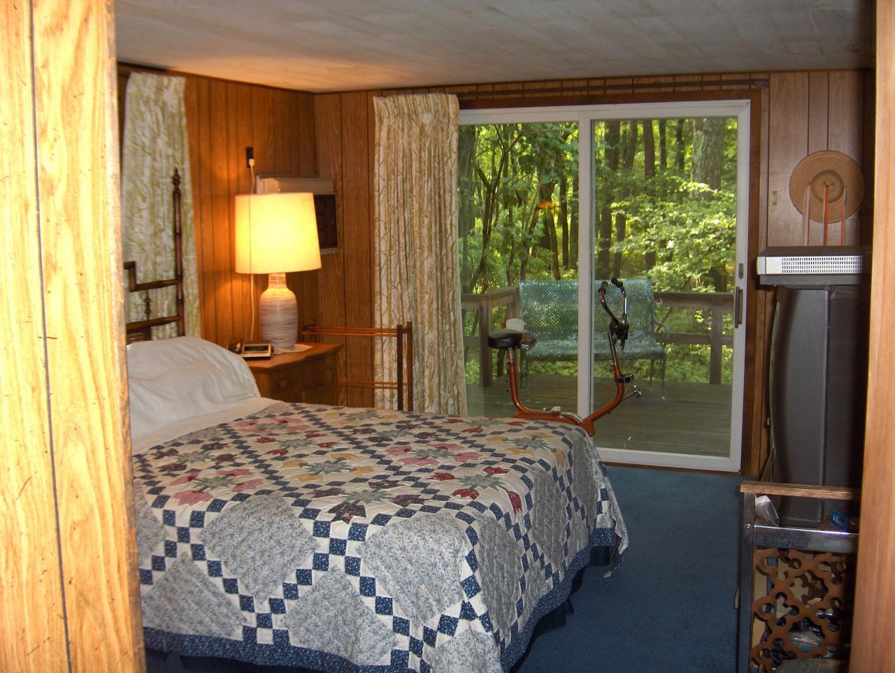 402 Big Oak Road Canadensis, PA 18325 - Photo 10 of 18 a bedroom with a bed mirror and a window