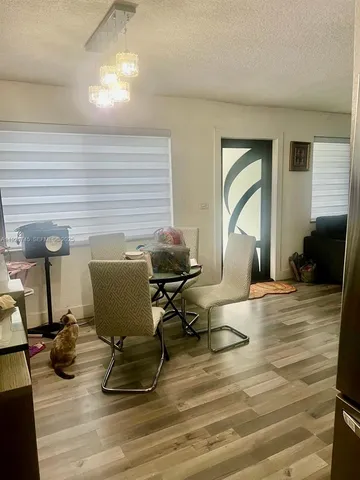 a workspace with furniture and a wooden floor