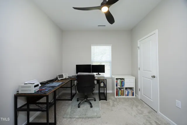 a view of a workspace with furniture