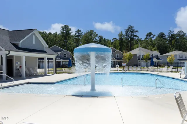 a front view of a house with swimming pool