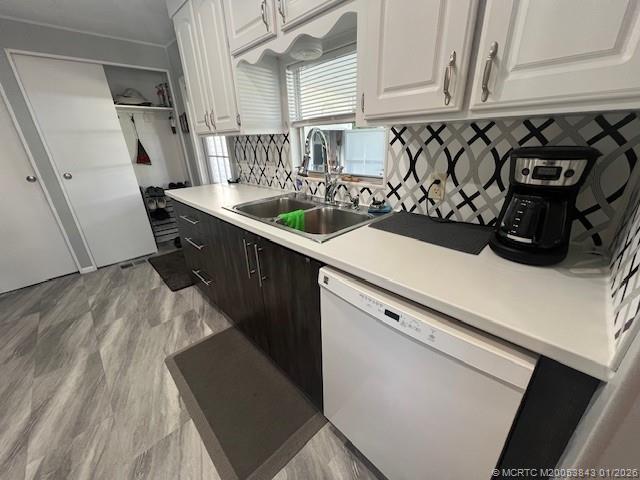 a kitchen with stainless steel appliances a sink a stove and cabinets