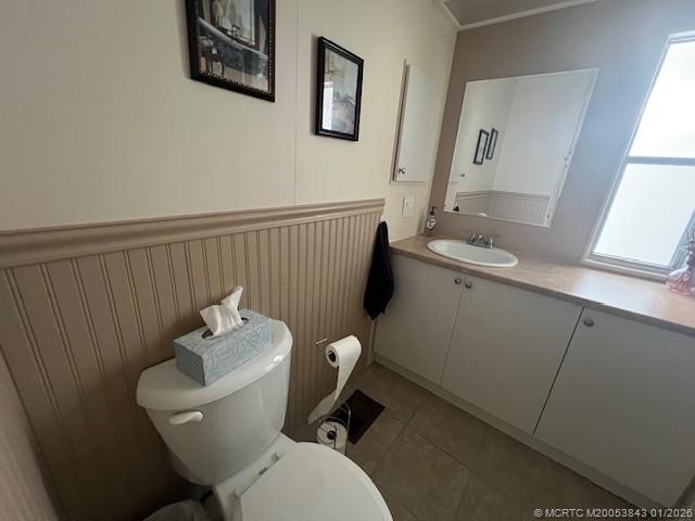 8709 Knight Road Boynton Beach, FL 33436 - Photo 20 of 39 a bathroom with a toilet sink and mirror