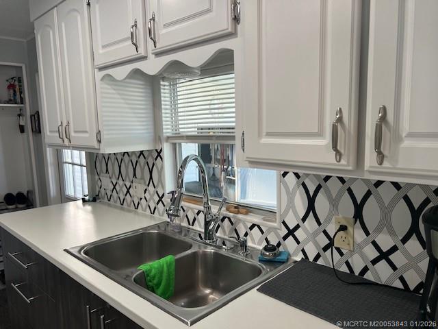 8709 Knight Road Boynton Beach, FL 33436 - Photo 2 of 39 a kitchen with a sink and a stove top oven