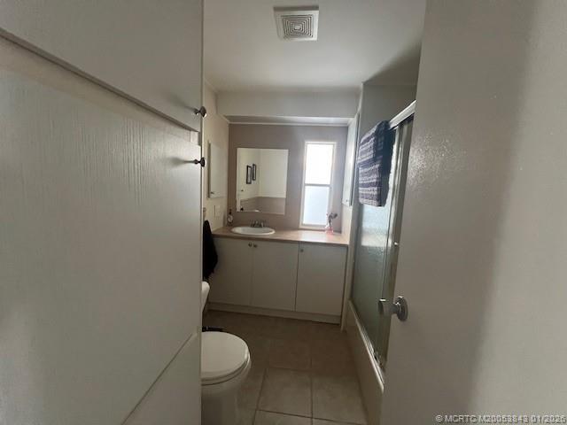 8709 Knight Road Boynton Beach, FL 33436 - Photo 21 of 39 a bathroom with a sink and mirror with toilet