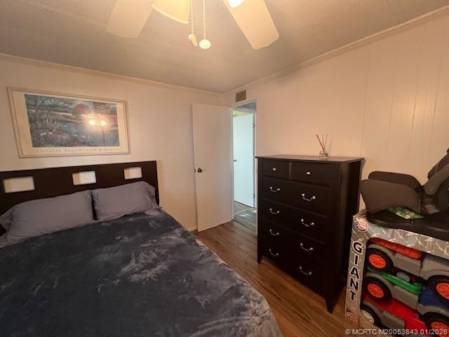 8709 Knight Road Boynton Beach, FL 33436 - Photo 24 of 39 a bedroom with a bed and dresser with mirror