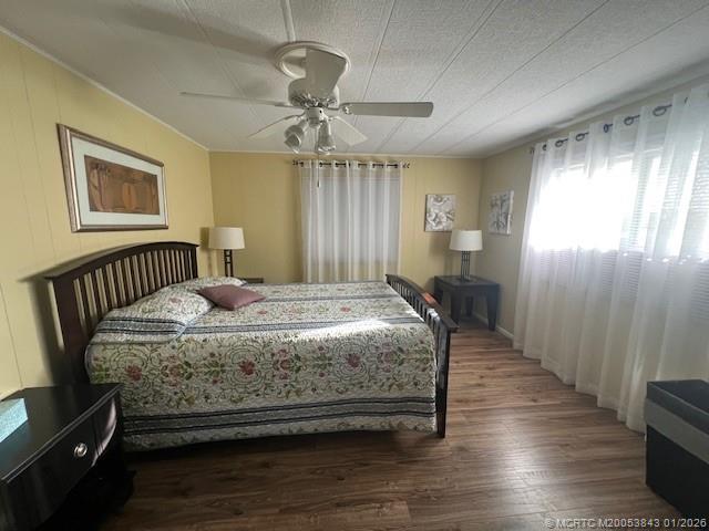 8709 Knight Road Boynton Beach, FL 33436 - Photo 25 of 39 a bedroom with a bed and wooden floor