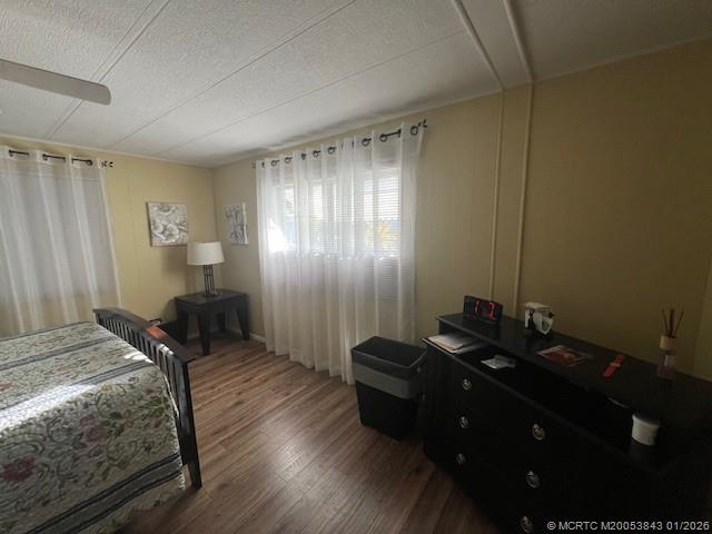 8709 Knight Road Boynton Beach, FL 33436 - Photo 26 of 39 a bedroom with a bed and wooden floor