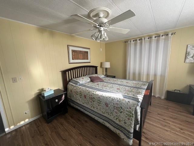 8709 Knight Road Boynton Beach, FL 33436 - Photo 27 of 39 a bedroom with a bed and wooden floor