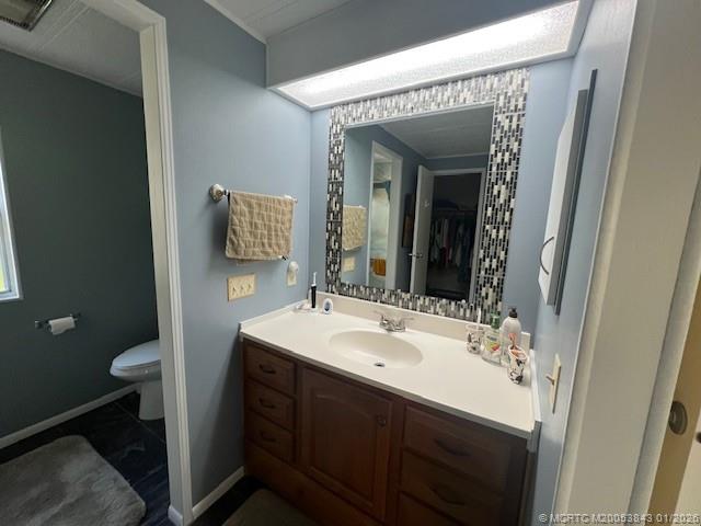 8709 Knight Road Boynton Beach, FL 33436 - Photo 28 of 39 a bathroom with a sink and a mirror