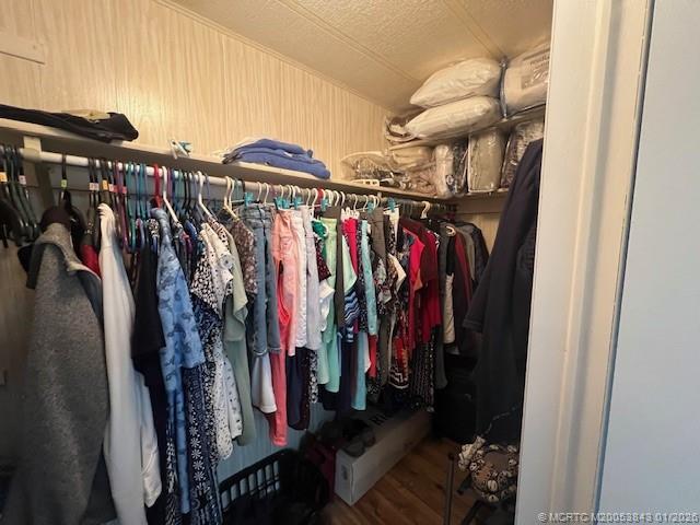 8709 Knight Road Boynton Beach, FL 33436 - Photo 29 of 39 a view of walk in closet with clothes