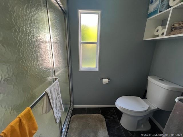 8709 Knight Road Boynton Beach, FL 33436 - Photo 30 of 39 a bathroom with a toilet and a sink