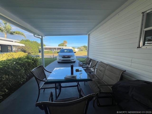 8709 Knight Road Boynton Beach, FL 33436 - Photo 32 of 39 a view of a chairs and table in the balcony