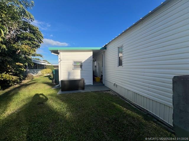 8709 Knight Road Boynton Beach, FL 33436 - Photo 36 of 39 a view of a backyard with plants and large trees