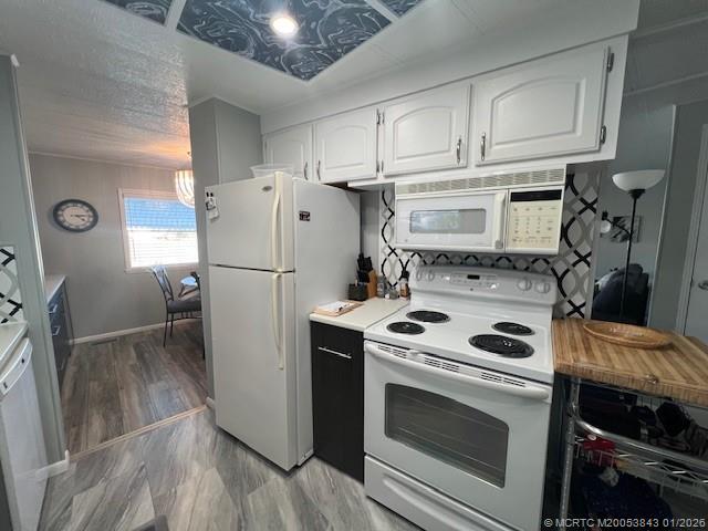 8709 Knight Road Boynton Beach, FL 33436 - Photo 4 of 39 a kitchen with stainless steel appliances a stove a refrigerator and cabinets
