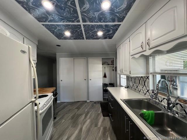 8709 Knight Road Boynton Beach, FL 33436 - Photo 5 of 39 a kitchen with granite countertop a sink stainless steel appliances a counter space and cabinets