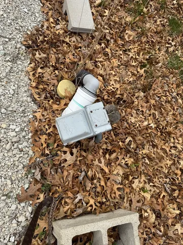 a view of a lake with a bench and trees