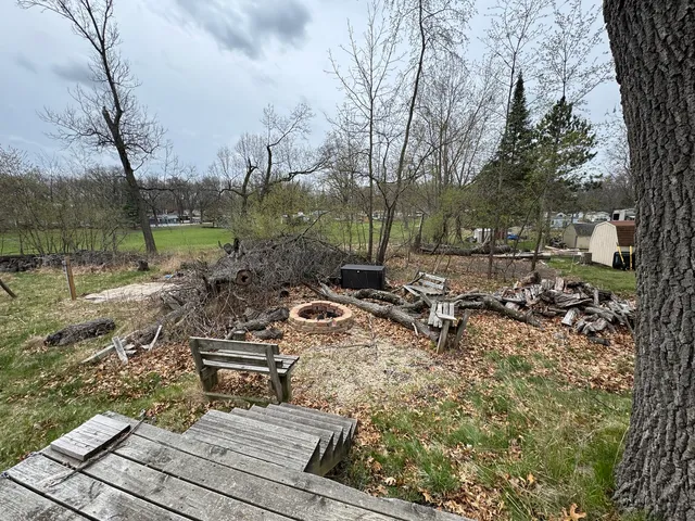 a view of a backyard with sitting area