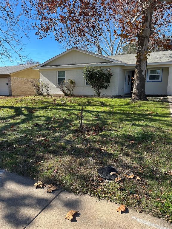 1202 South Clark Road Cedar Hill, TX 75104 - Photo 1 of 1 a front view of a house with a garden