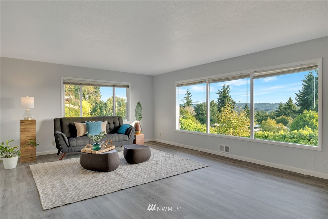 11409 Karshner Road East Edgewood, WA 98372 - Photo 4 of 28 a living room with furniture and a large window
