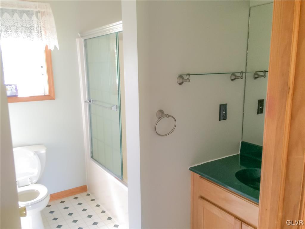 968 Renaldi Road Wind Gap, PA 18091 - Photo 15 of 18 a bathroom with a sink a toilet and shower