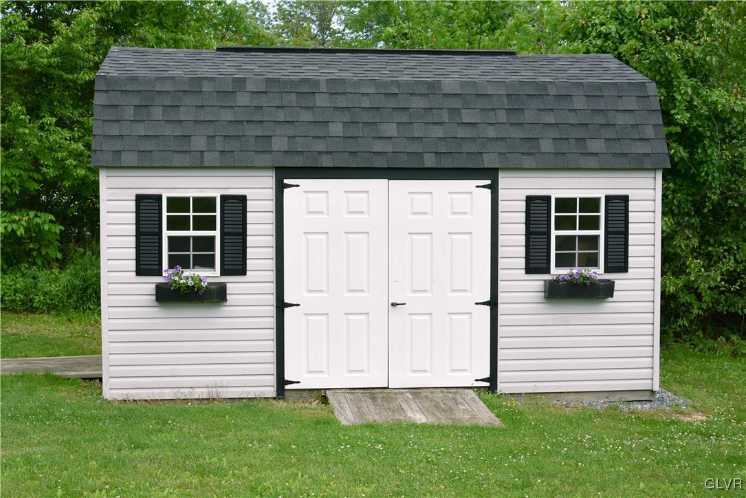 968 Renaldi Road Wind Gap, PA 18091 - Photo 5 of 18 a view of wooden house with a small yard