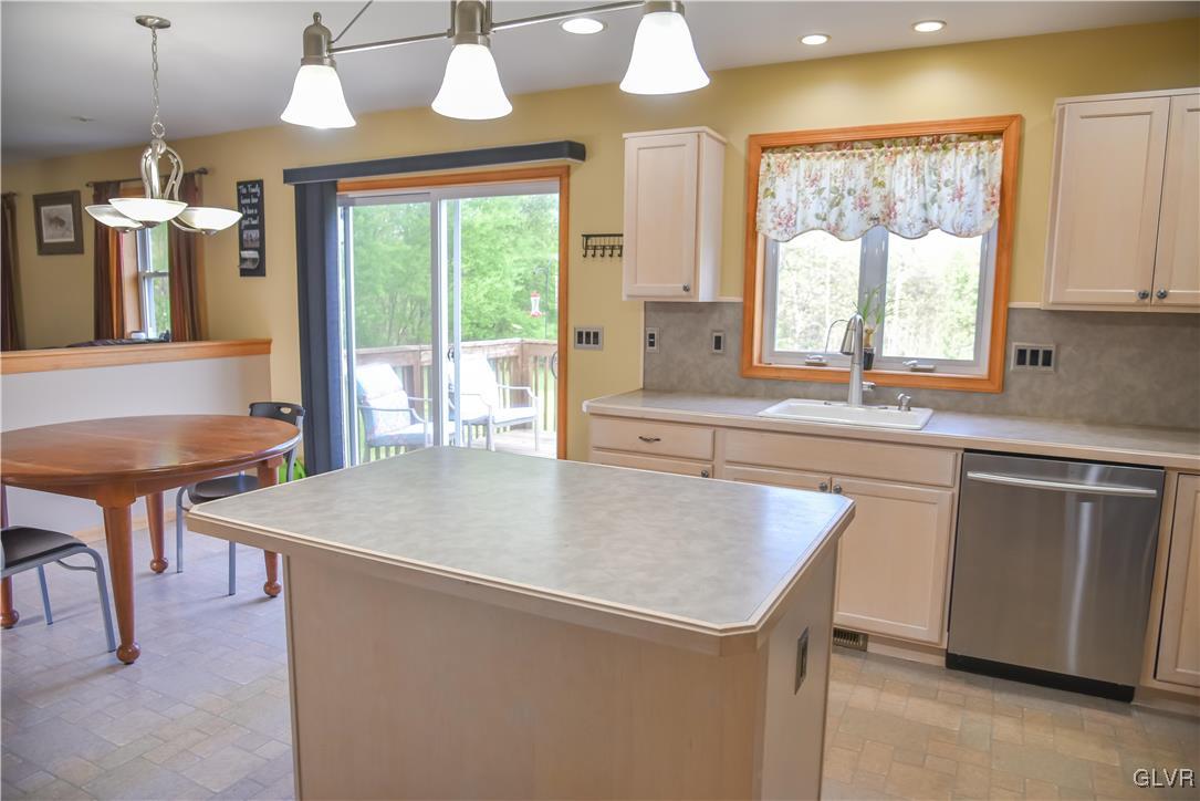 968 Renaldi Road Wind Gap, PA 18091 - Photo 8 of 18 a kitchen with a table chairs sink and cabinets