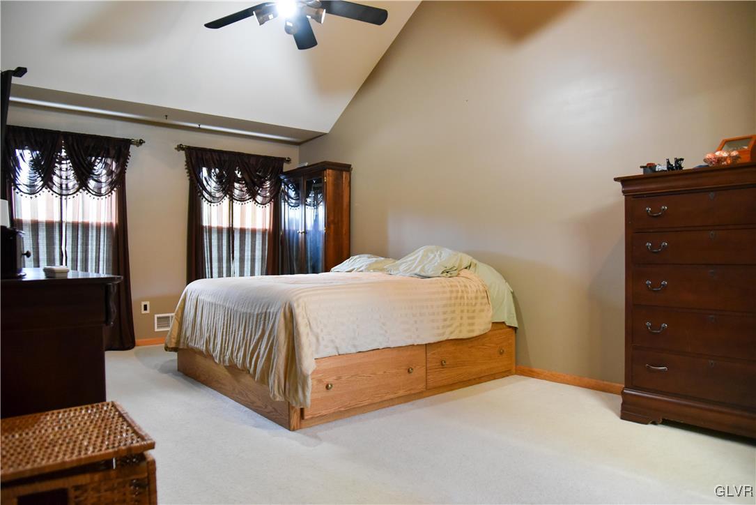 968 Renaldi Road Wind Gap, PA 18091 - Photo 10 of 18 a bed sitting in a bedroom next to a window