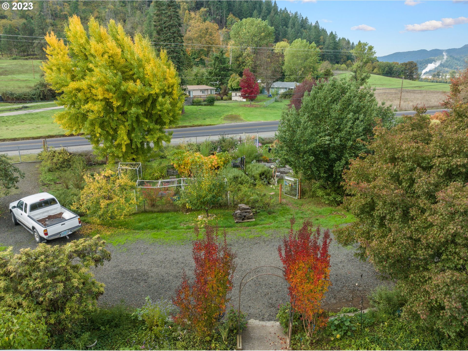 4235 Canyonville-Riddle Road Riddle, OR 97469 - Photo 3 of 38 a view of a garden with a lake