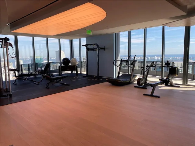 wooden floor in livingroom with furniture and windows
