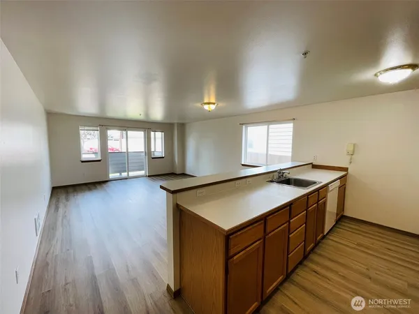 a kitchen that has a microwave a stove and a refrigerator