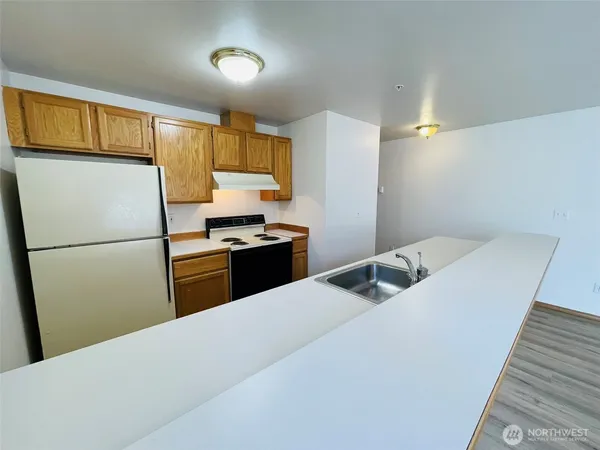 a kitchen with a sink and a window