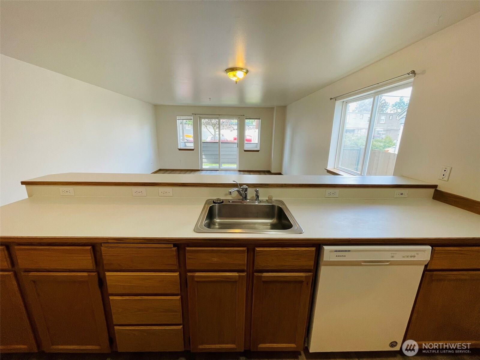 8830 Nesbit Avenue North Seattle, WA 98103 - Photo 17 of 32 a kitchen with a sink and a window