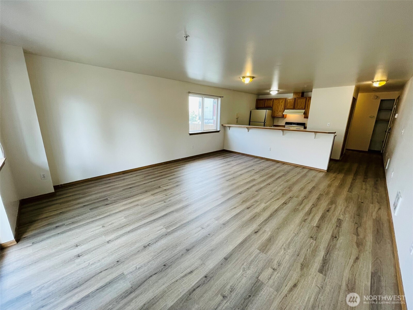 8830 Nesbit Avenue North Seattle, WA 98103 - Photo 22 of 32 a view of a livingroom with furniture and wooden floor