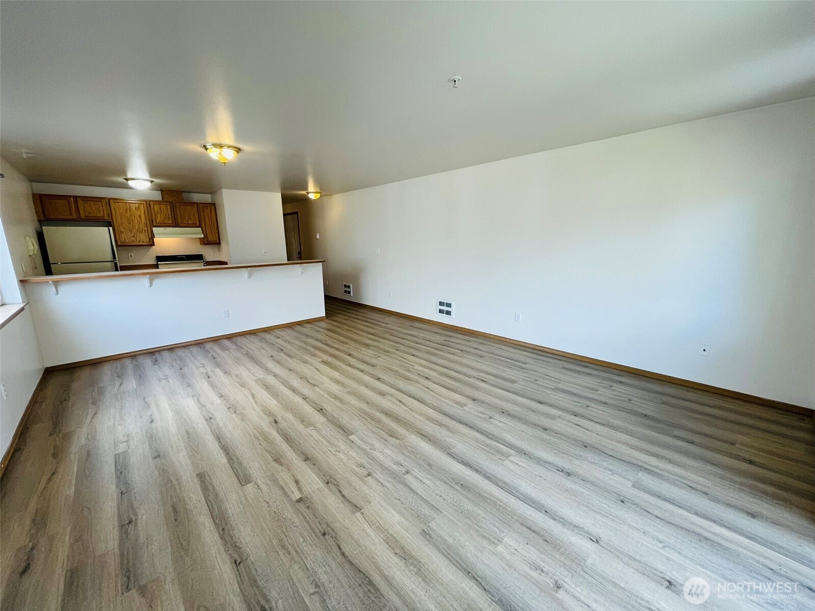 8830 Nesbit Avenue North Seattle, WA 98103 - Photo 23 of 32 a view of a room with wooden floor
