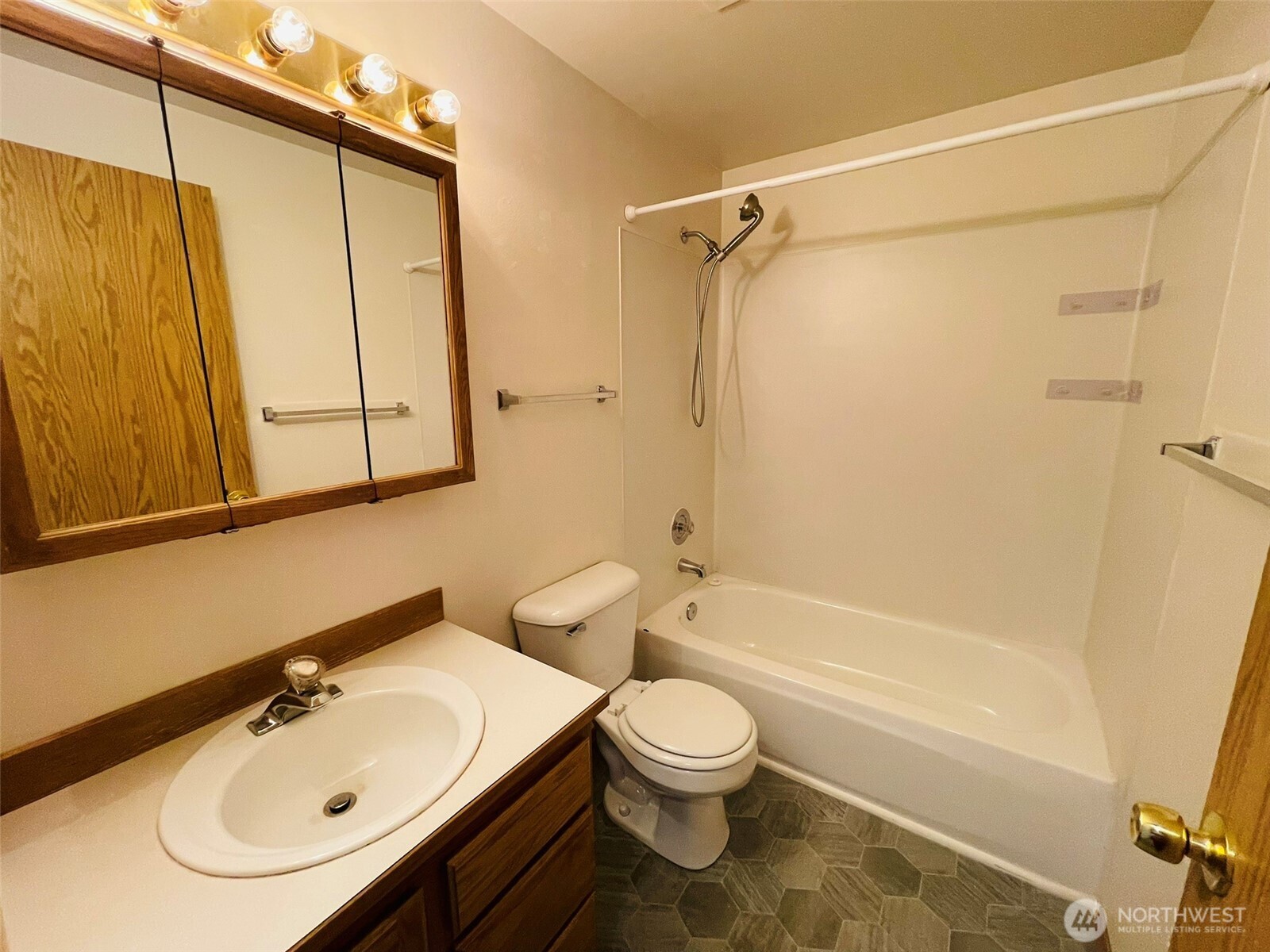 8830 Nesbit Avenue North Seattle, WA 98103 - Photo 24 of 32 a bathroom with a sink a toilet and shower