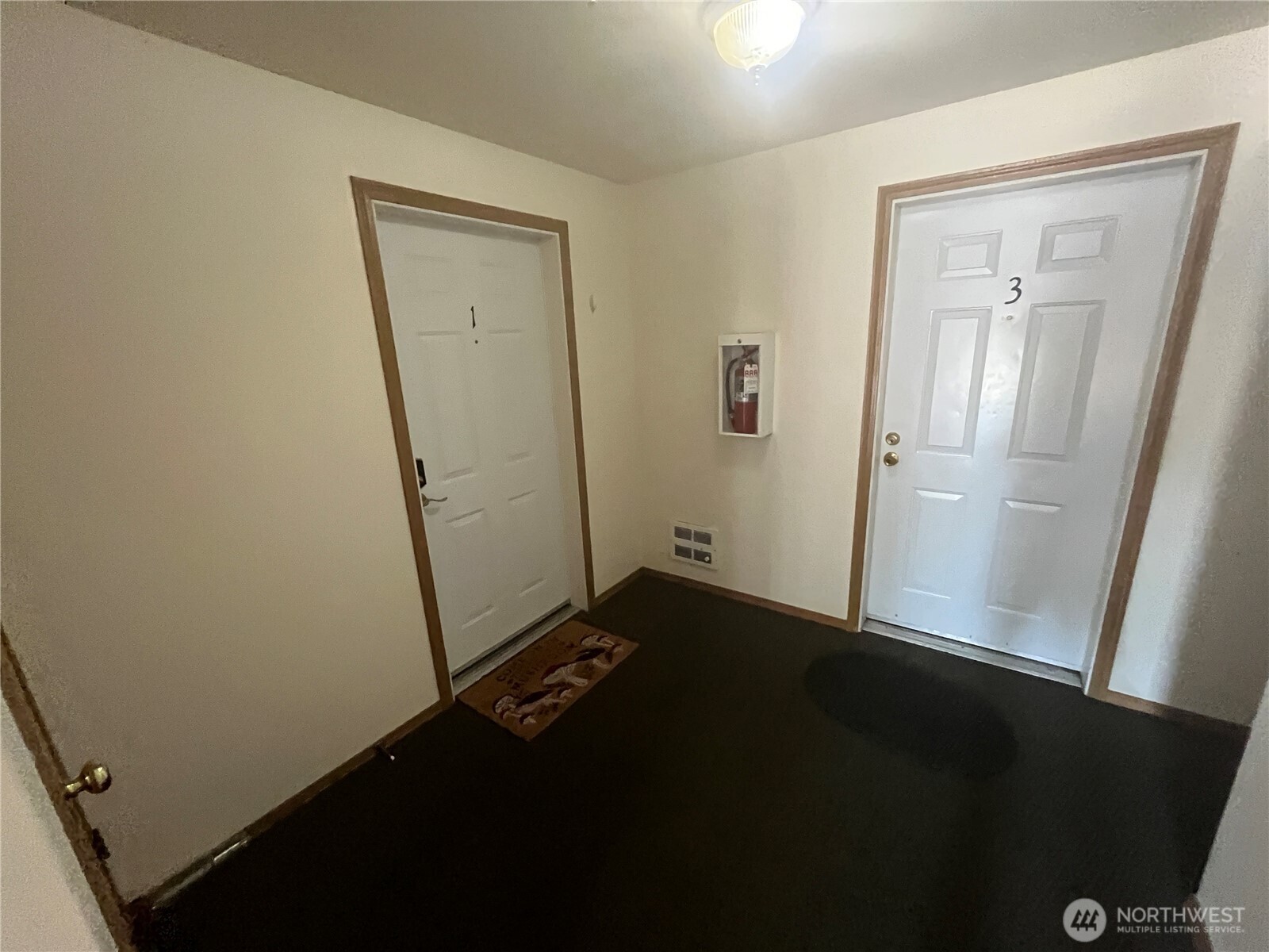 8830 Nesbit Avenue North Seattle, WA 98103 - Photo 28 of 32 an empty room with a door