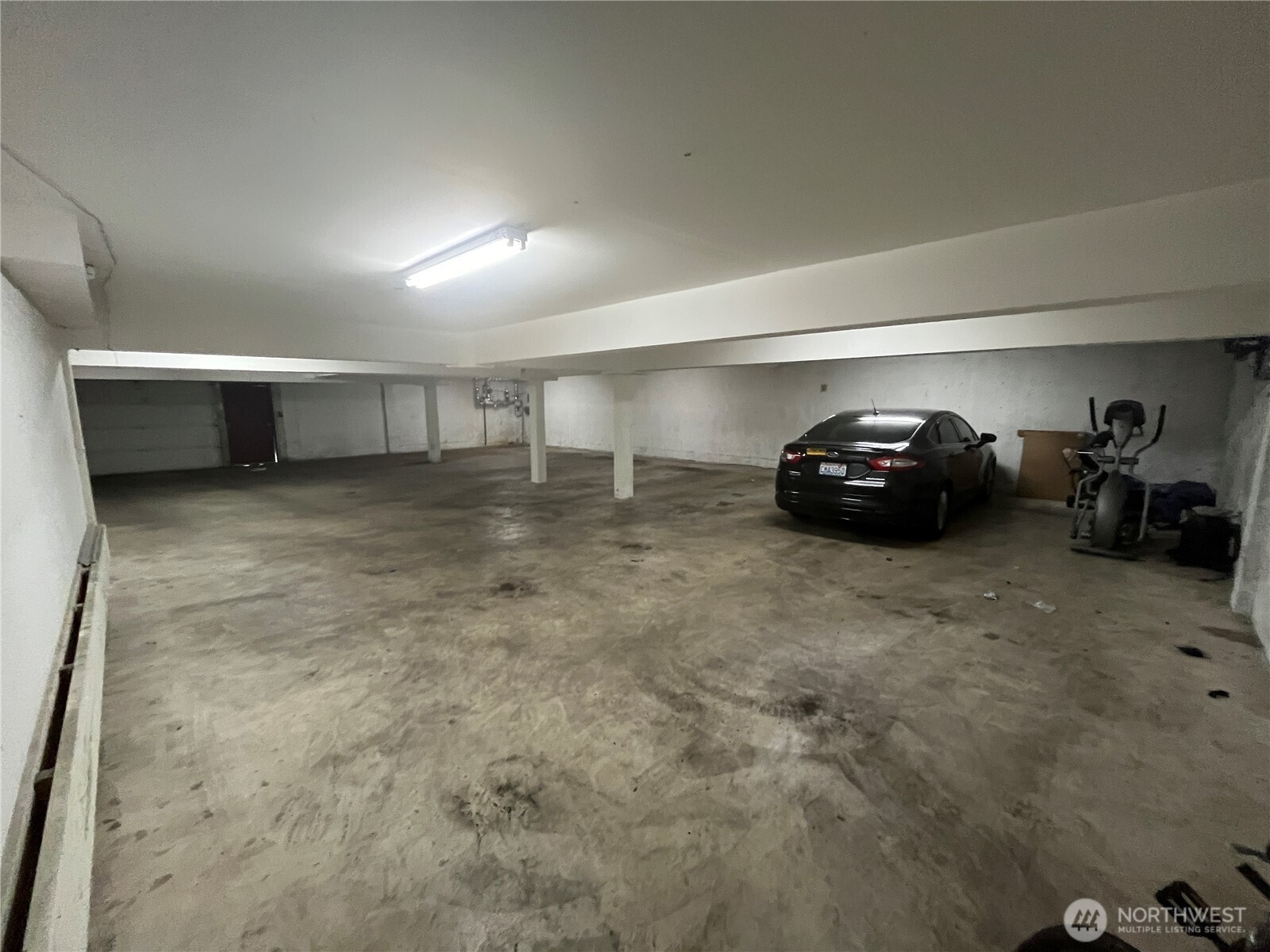 8830 Nesbit Avenue North Seattle, WA 98103 - Photo 29 of 32 a car parked in parking