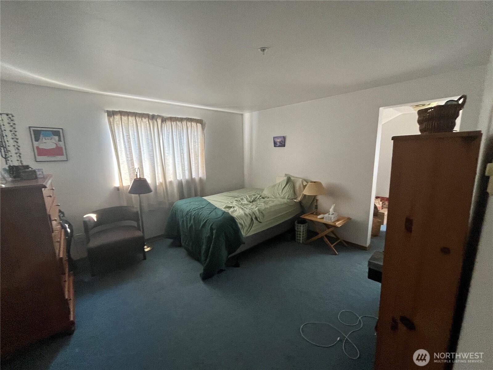 8830 Nesbit Avenue North Seattle, WA 98103 - Photo 30 of 32 a bedroom with a bed and a couch