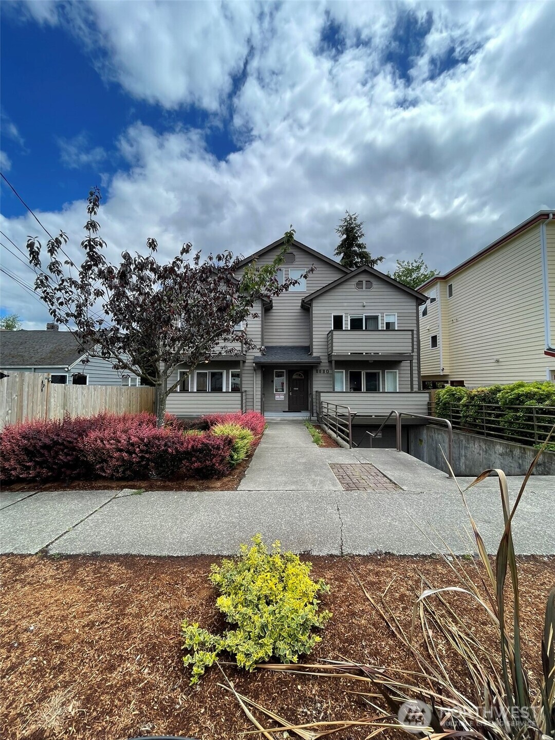 8830 Nesbit Avenue North Seattle, WA 98103 - Photo 10 of 32 a view of multiple houses with a yard