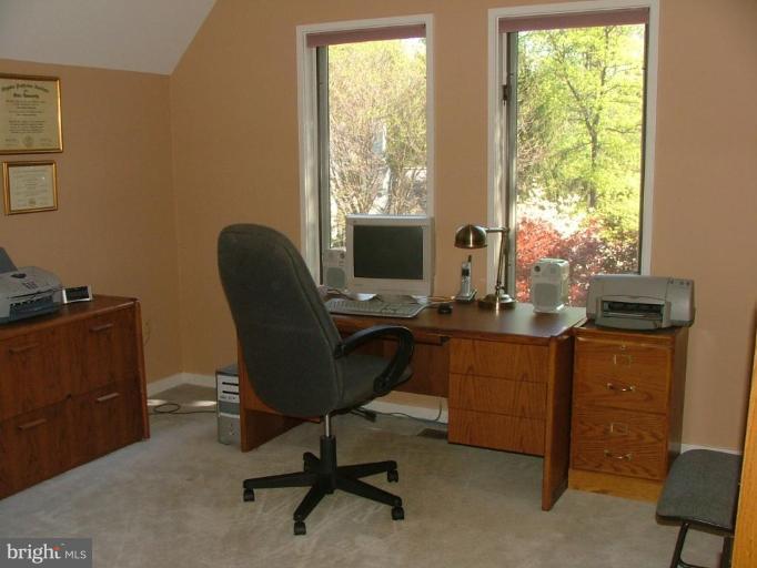 11591 Greenwich Point Road Reston, VA 20194 - Photo 11 of 30 a view of a workspace with furniture and a window